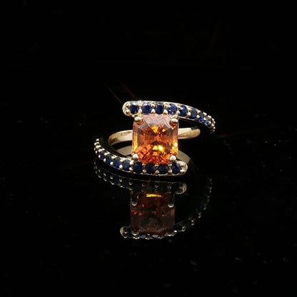 Natural Orange Sapphire Set In 14k Yellow Gold With Blue Sapphire Accent Stones. Regard Jewelry Austin Texas