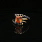 Natural Orange Sapphire Set In 14k Yellow Gold With Blue Sapphire Accent Stones. Regard Jewelry Austin Texas