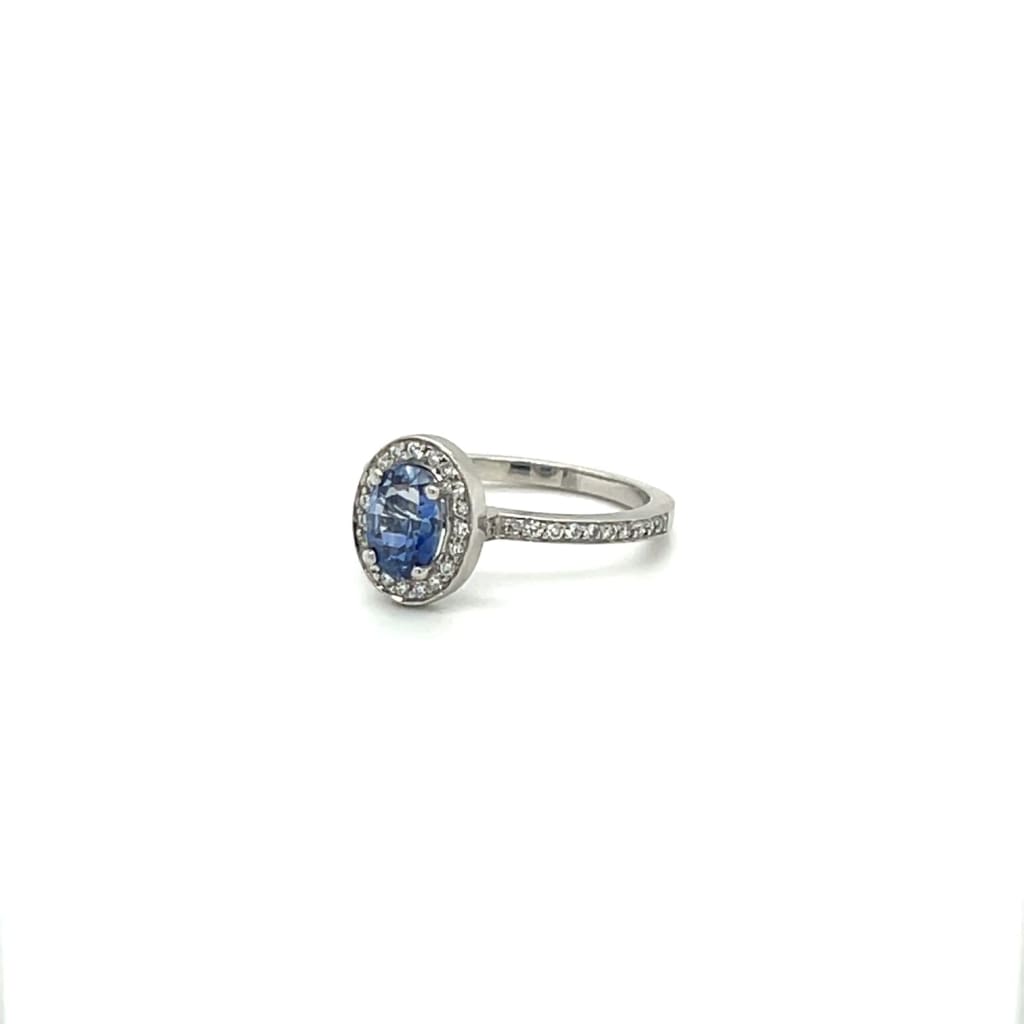 Sapphire Platinum Ring with Diamond Halo at Regard Jewelry