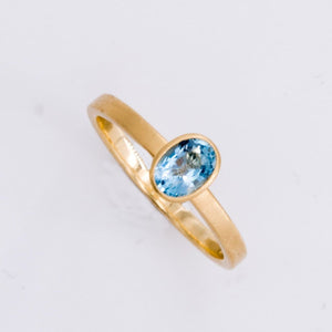 18k Matte Yellow Gold Yumdrop Ring with a Oval Aquamarine by Kimberly Collins Colored Gems at Regard - Regard Jewelry