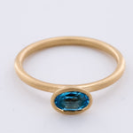 Load image into Gallery viewer, 18k Matte Yellow Gold Yumdrop Ring with a Oval Blue Topaz by Kimberly Collins Colored Gems at Regard - Regard Jewelry
