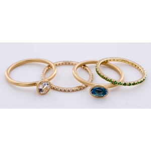 18k Matte Yellow Gold Yumdrop Ring with a Oval Blue Topaz by Kimberly Collins Colored Gems at Regard - Regard Jewelry
