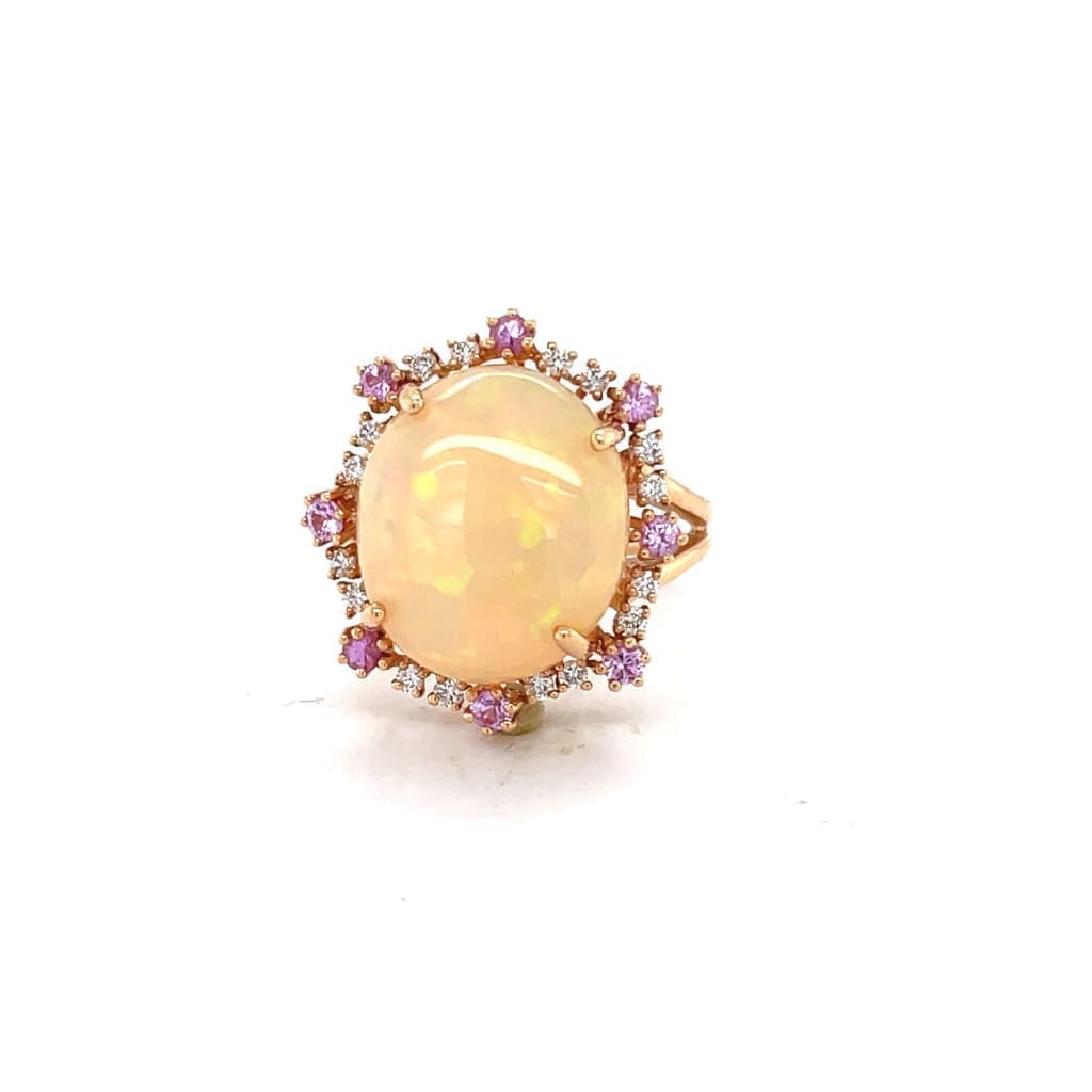 6.81 CT ETHIOPIAN OPAL 18 KARAT RING WITH DIAMOND AND SAPPHIRE ACCENT STONES AT REGARD JEWELRY IN - Regard Jewelry