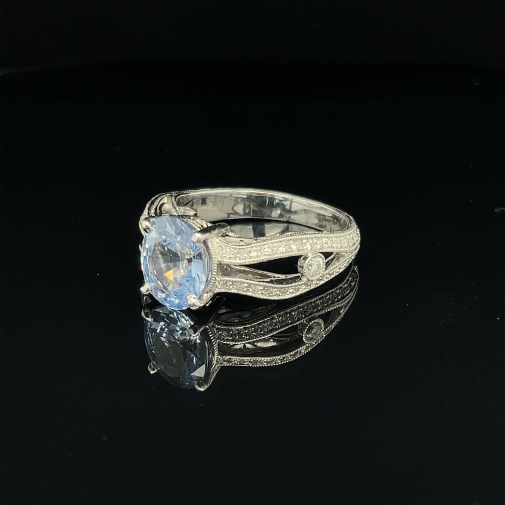 Amazing Oval 1.28 ct Blue Sapphire Set in a 18k white gold Ring with .33 cttw Accent Diamonds at - Regard Jewelry