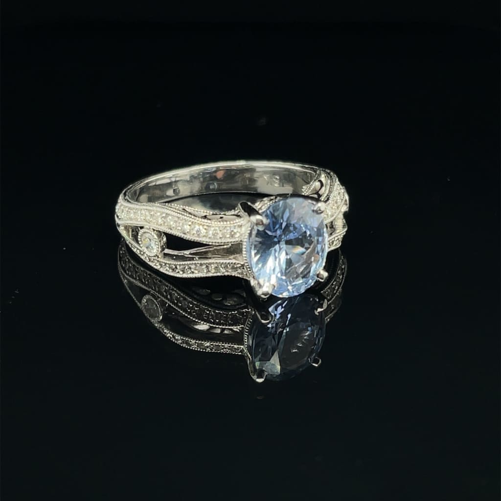 Amazing Oval 1.28 ct Blue Sapphire Set in a 18k white gold Ring with .33 cttw Accent Diamonds at - Regard Jewelry