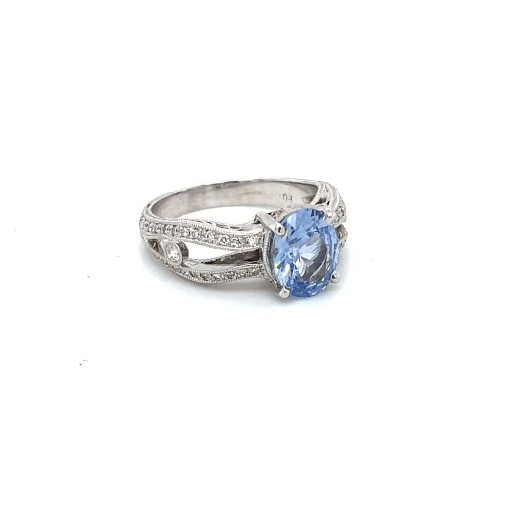 Amazing Oval 1.28 ct Blue Sapphire Set in a 18k white gold Ring with .33 cttw Accent Diamonds at - Regard Jewelry