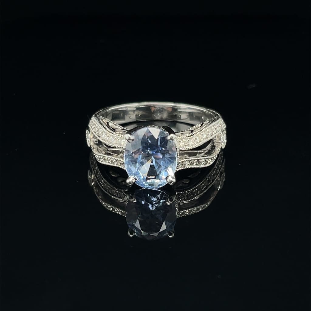 Amazing Oval 1.28 ct Blue Sapphire Set in a 18k white gold Ring with .33 cttw Accent Diamonds at - Regard Jewelry