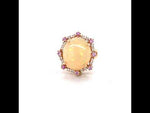 Load and play video in Gallery viewer, 6.81 CT ETHIOPIAN OPAL 18 KARAT RING WITH DIAMOND AND SAPPHIRE ACCENT STONES AT REGARD JEWELRY IN
