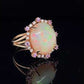 6.81 CT ETHIOPIAN OPAL 18 KARAT RING WITH DIAMOND AND SAPPHIRE ACCENT STONES AT REGARD JEWELRY IN