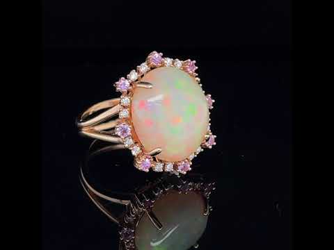 6.81 CT ETHIOPIAN OPAL 18 KARAT RING WITH DIAMOND AND SAPPHIRE ACCENT STONES AT REGARD JEWELRY IN