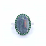 Oval Black Opal With Tsavorite Garnet Halo in Austin, Texas - Regard Jewelry