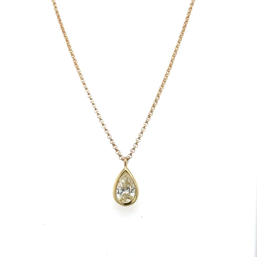 Pear Shape Diamond Bezel Set in Yellow Gold at Regard Jewelry in Austin, Texas - Regard Jewelry