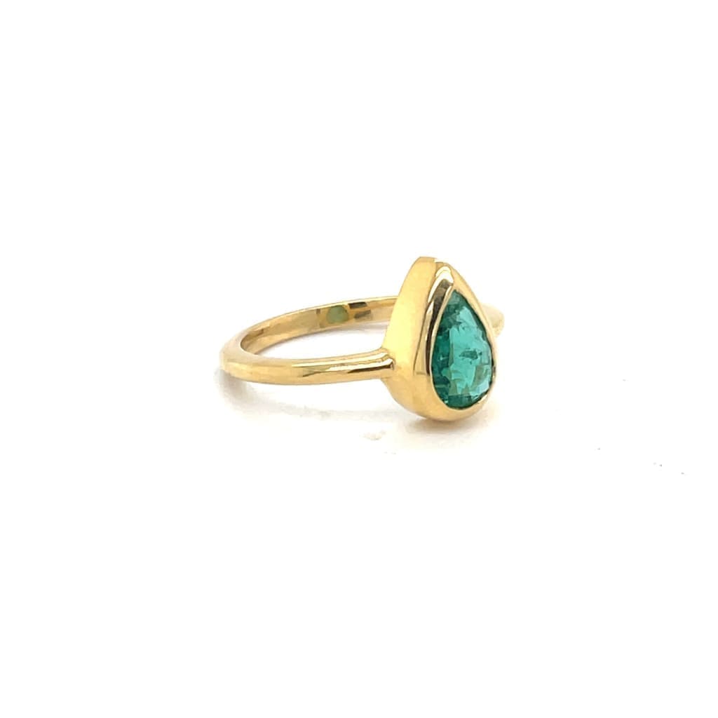 Pear Shape Emerald Set in 14K Yellow Gold Bezel Ring at Regard Jewelry in Austin, Texas - Regard Jewelry