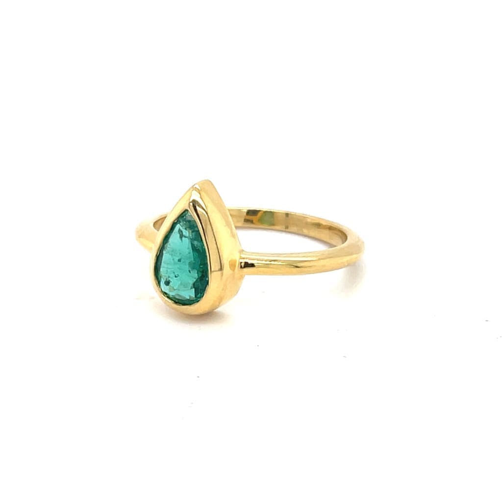 Pear Shape Emerald Set in 14K Yellow Gold Bezel Ring at Regard Jewelry in Austin, Texas - Regard Jewelry