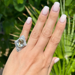 Platinum Oval Yellow Sapphire Ring with Double Diamond Halo at Regard Jewelry in Austin, Texas - Regard Jewelry