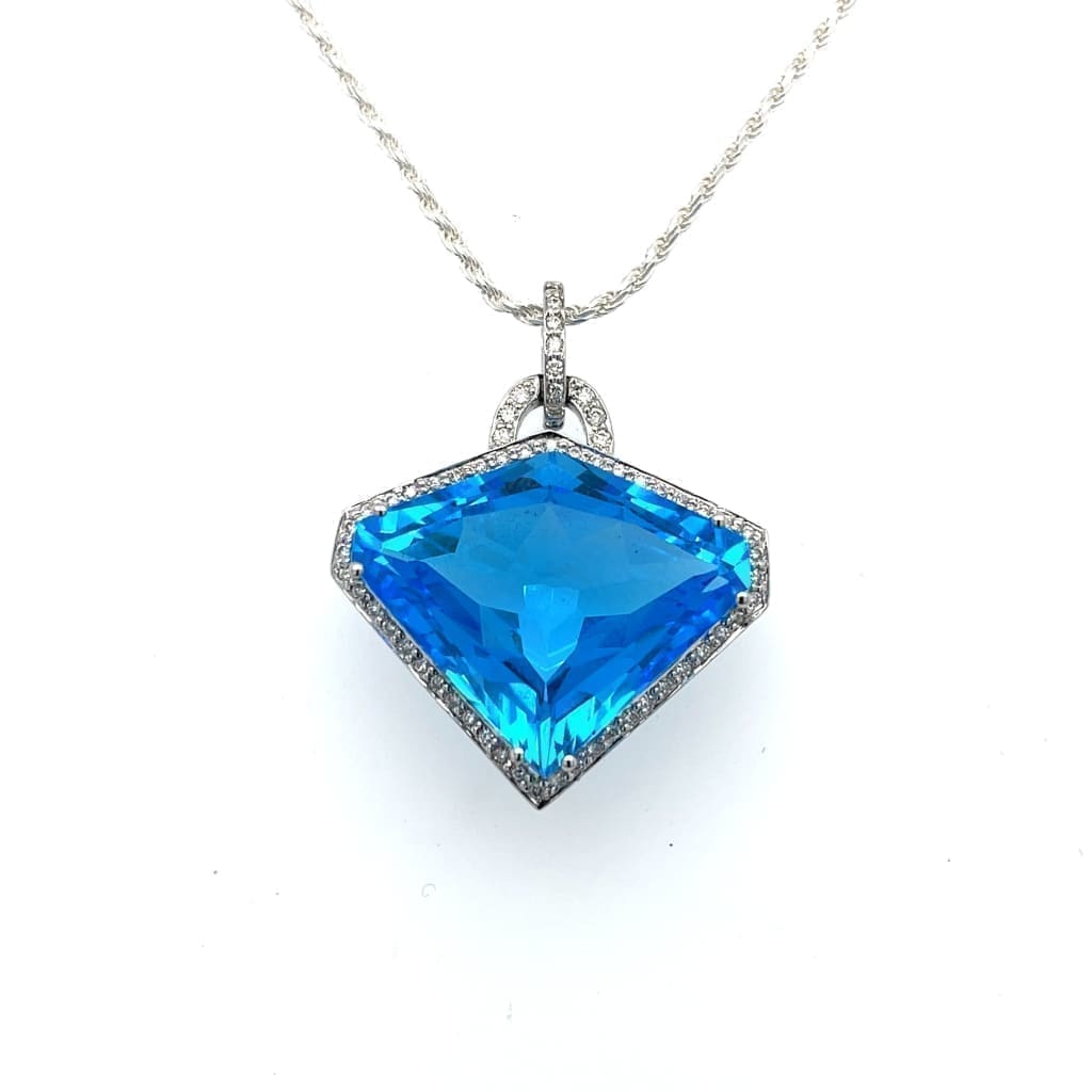 Shield Cut Blue Topaz Set in a 14k White Gold Pendant with Accent Diamonds at Regard Jewelry in - Regard Jewelry